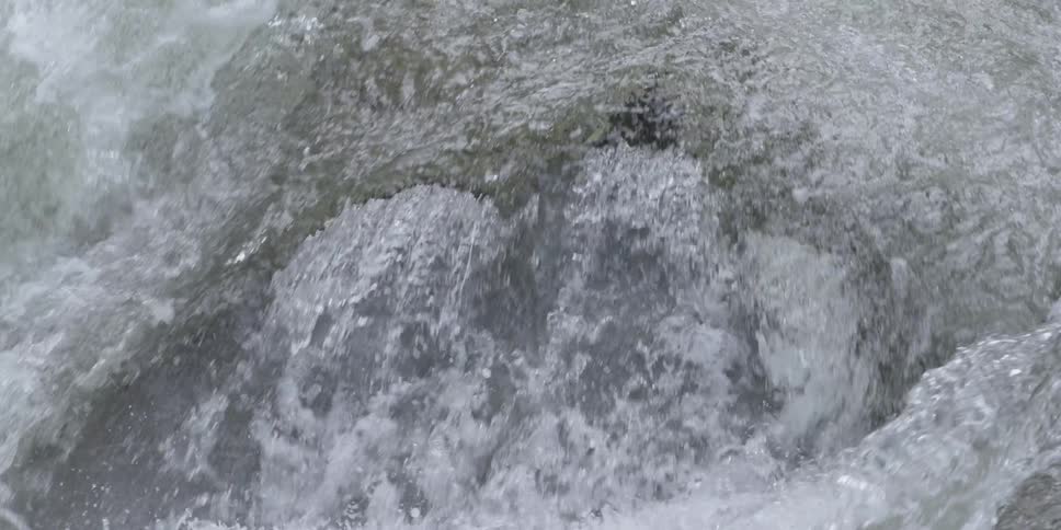 Rapidly moving water flowing in a river