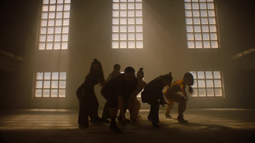 A group of people dance together