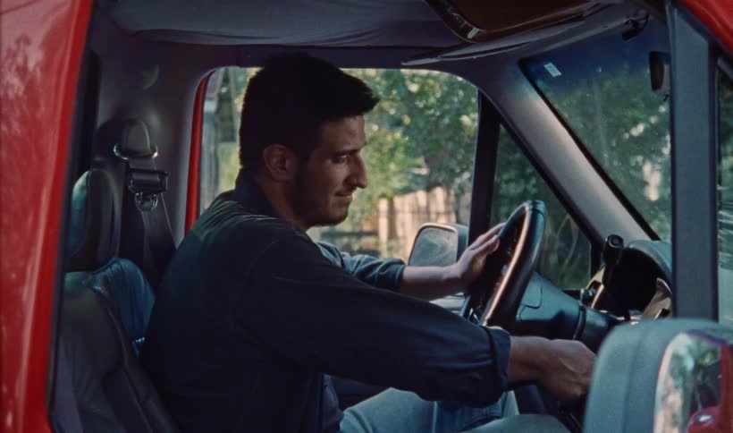 A man turns the key in the ignition