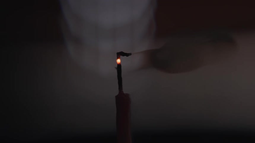 A view of a candle being blown out