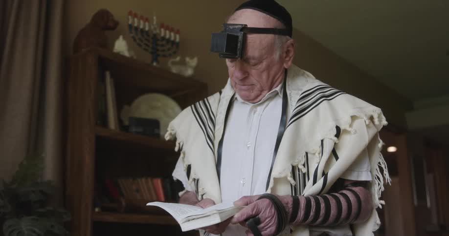 A man is praying at home