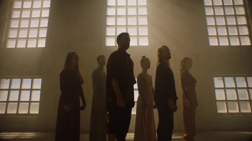 A group of people are standing in a room together