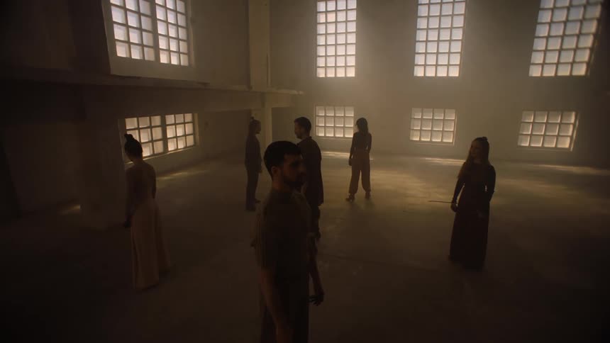 A group of people are standing in a room together