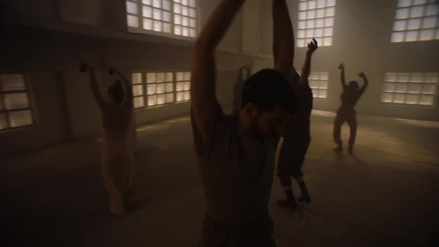 A group of people dancing in a room