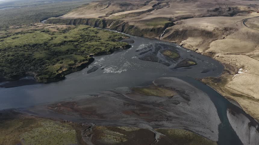 Aerial view of a landscape and river is displayed