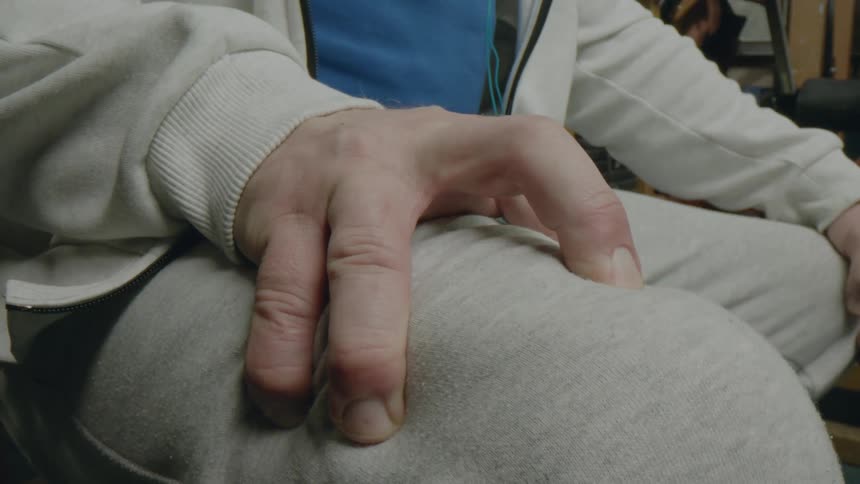 A view of a person grabbing their leg