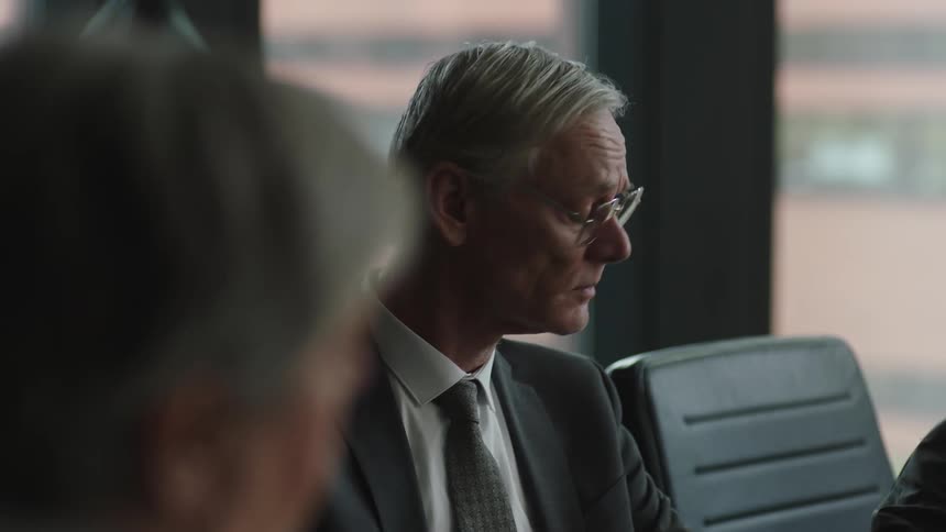 A group of bosses all in a large meeting together