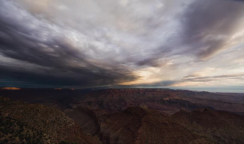 Time-lapse of dark clouds moving over a desolate area