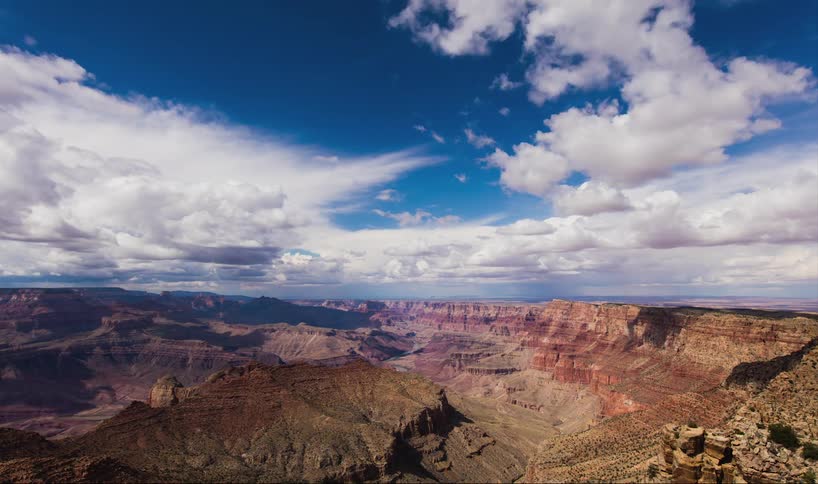 Time-lapse of clouds moving over a canyon area