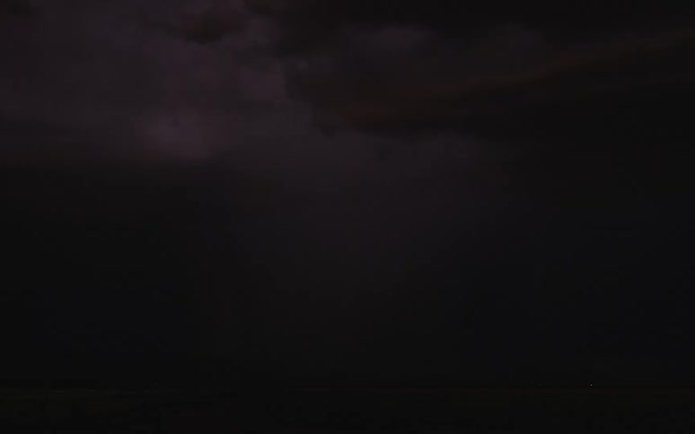 Lightning flashing and clouds flowing in the evening sky