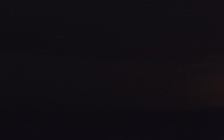 Lightning flashing in the night sky