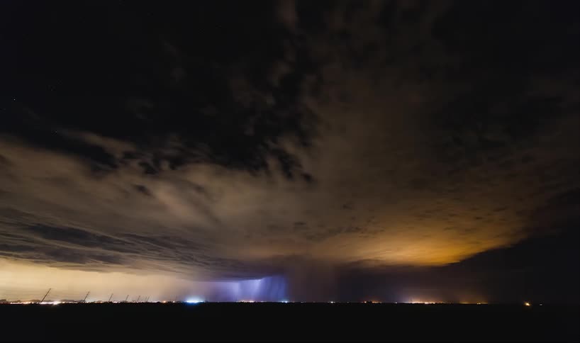 Lightning flashing and clouds flowing in the night sky