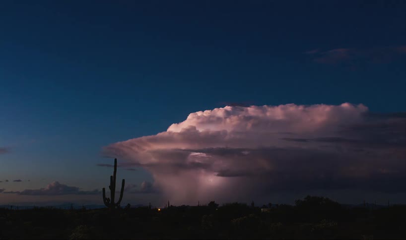 Lightning flashes in some clouds as it turns to nighttime