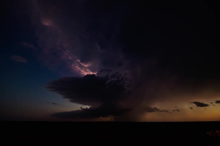 Time lapse of a storm raging with lightning at sunset