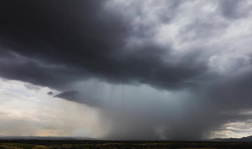 A storm builds near sunset