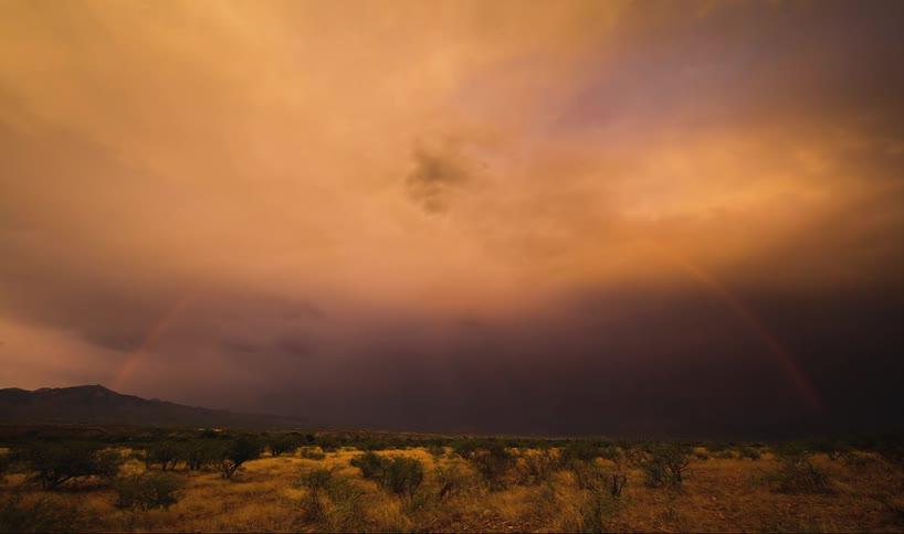 Time-lapse of a rainbow disappearing into the clouds