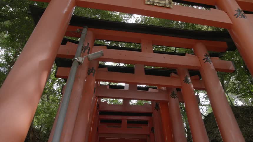 Red pillars outside forming a tunnel