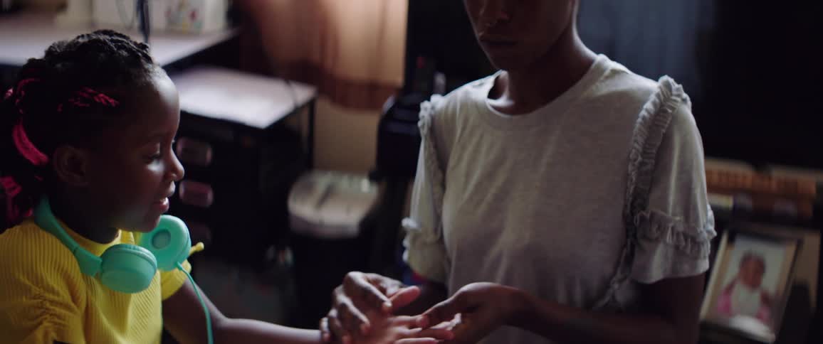 A woman and child count on their fingers