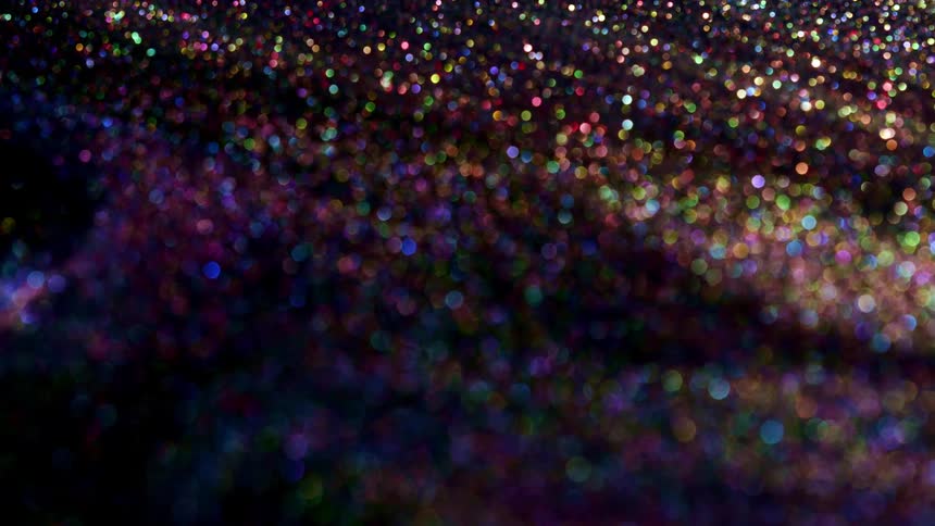 Purple substance with pink sparkles twinkles as it moves