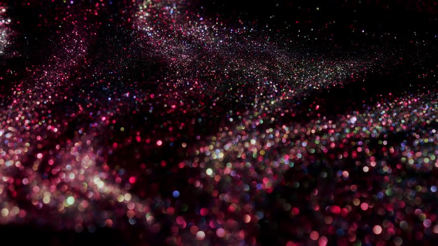 Shiny purple glitter like substance with pink sparkles twinkles as it moves