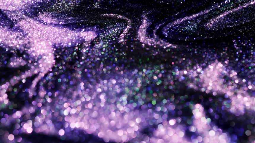 Shimmering bright colorful purple glitter moving and flowing slowly