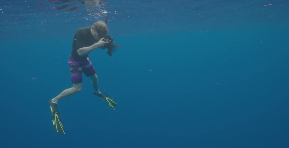 A man photographs underwater