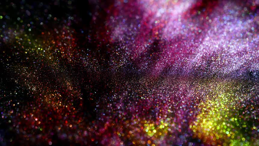Shimmering magenta bright yellow colorful gold and purple glitter moving and flowing slowly