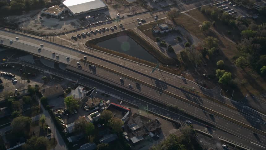 Aerial video footage showcasing light traffic on Highway 50 in Orlando at sunrise Florida