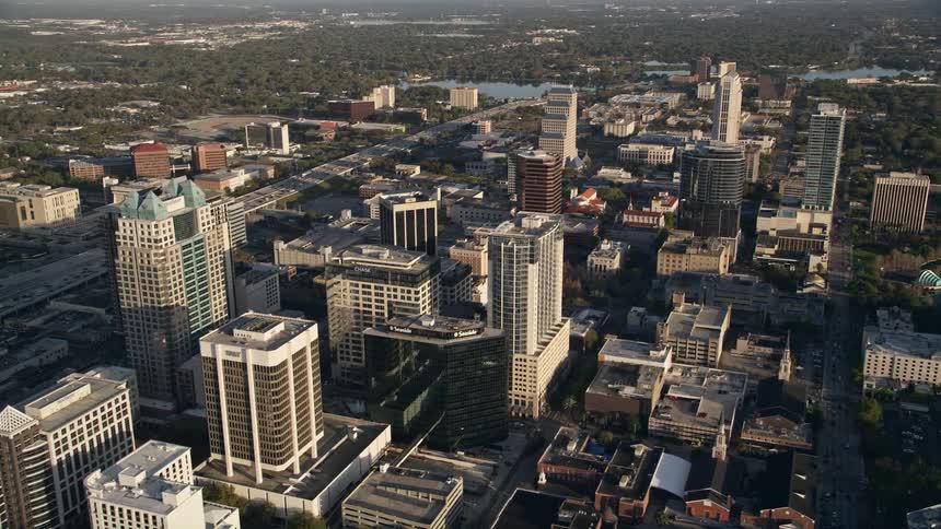 Aerial view at sunrise of office buildings in Downtown Orlando during a sunny day in Florida