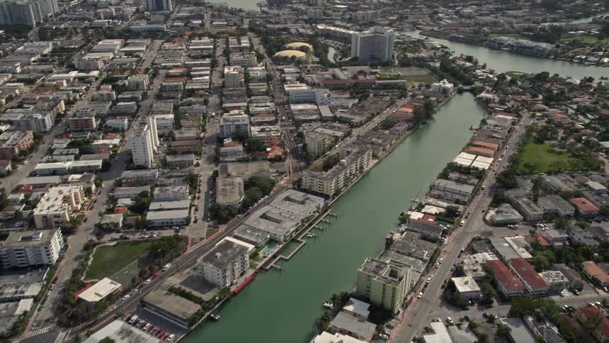 A flyover of residential apartment buildings and canals between Biscayne Point and Miami Beach in sunny south Florida
