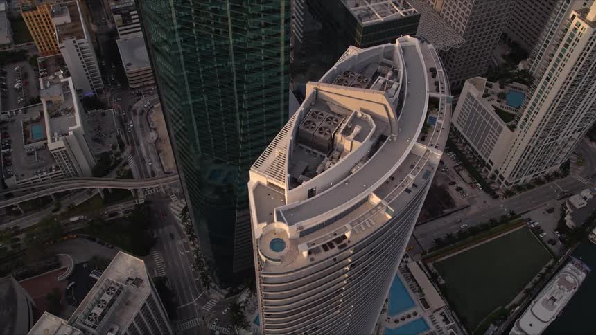 Aerial footage of Downtown Miami at sunset showcases modern high-rise buildings such as the Epic Hotel and Wells Fargo Center