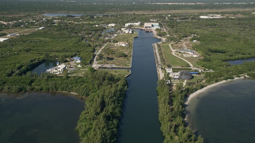 Aerial shot of Harbor Branch Ocean Institute at Fort Pierce Florida with a pan and reveal as the camera focuses on the scientific facilities