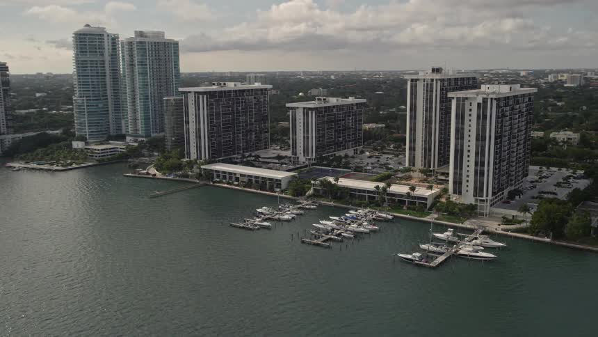 A breathtaking aerial view of waterfront condo complexes on the shores of Biscayne Bay in Downtown Miami Florida
