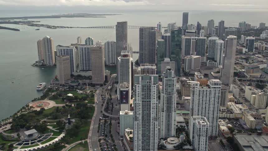 Approaching Downtown Miami high-rises by panning from four skyscrapers