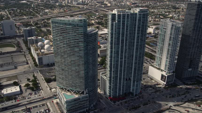 Thrilling daytime aerial view of four towering skyscrapers in sunny downtown Miami Florida showcasing the bustling metropolis of the East Coast and its stunningly breathtaking architecture