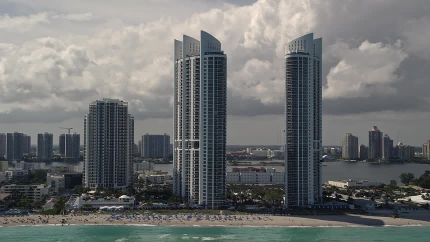 Luxury resort hotels on the beach in Sunny Isles Beach Florida captured through 5K aerial footage