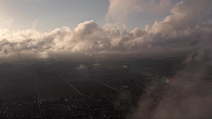 A breathtaking aerial view of Kendall Florida showcasing a stunning break in the clouds at sunset