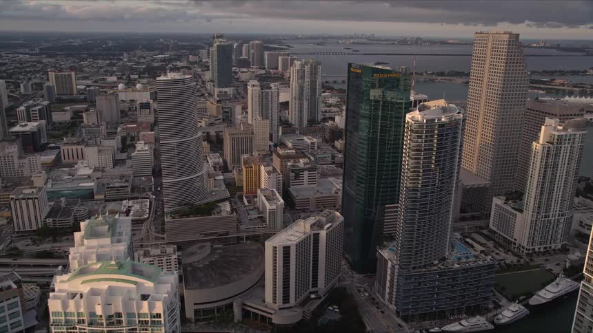 Approaching Downtown Miamis Epic Hotel and Wells Fargo Center at sunset soar over Floridas modern high-rise buildings and skyscrapers