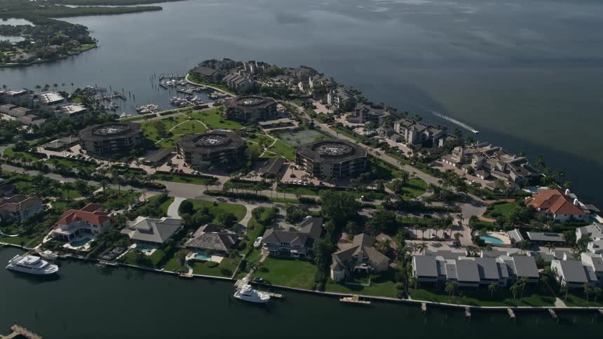 Aerial flyover of waterfront homes in Melbourne Beach Florida along the Indian River showcasing luxury waterfront properties