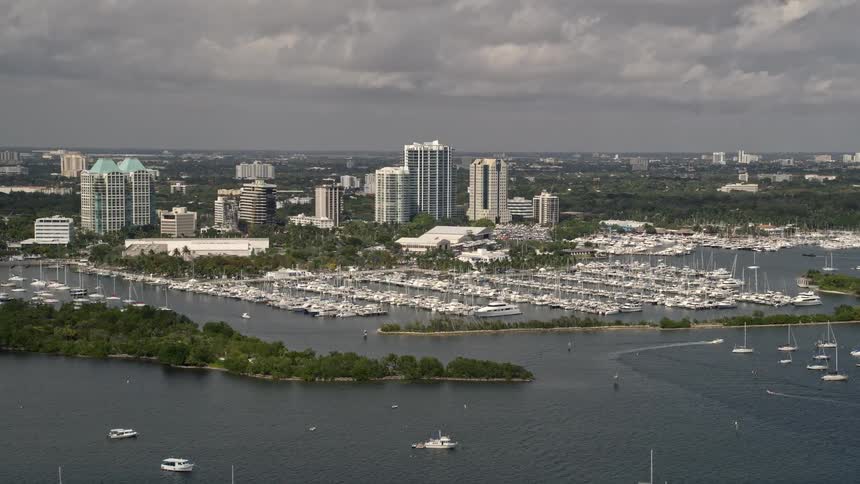 Sailboats docked at Dinner Key Marina in Coconut Grove Florida viewed from an aerial 5K drone showcasing the stunning coastline