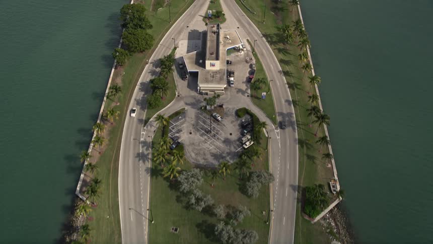 An aerial view of cars approaching the Broad Causeway linking North Miami to Bay Harbor Islands in Florida on a sunny day