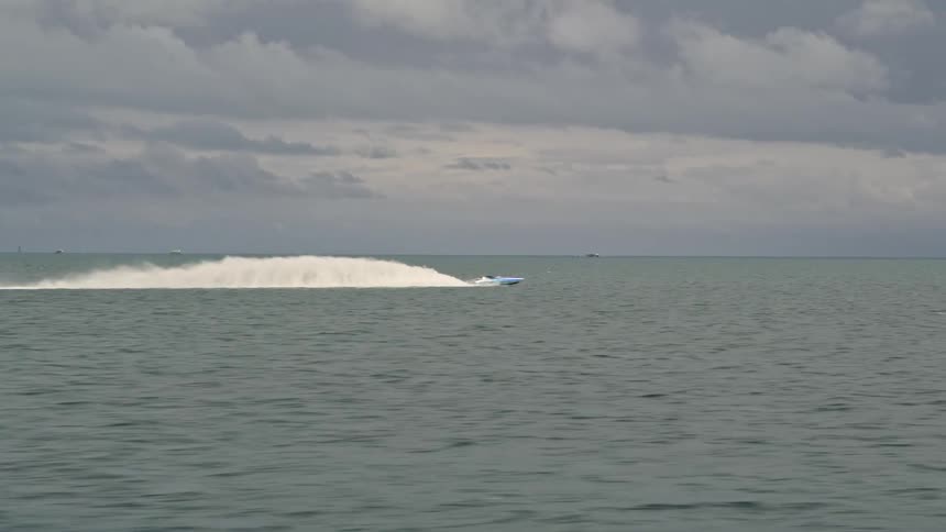 A sport boat races across Biscayne Bay in Florida captured in stunning aerial footage