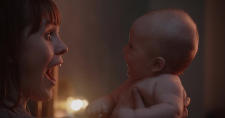 A mother holding onto her baby