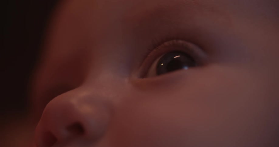 The baby is looking around