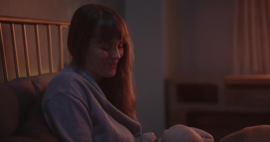 A mother is talking to her baby