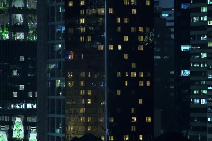 Time lapse of illuminated high rise buildings at night