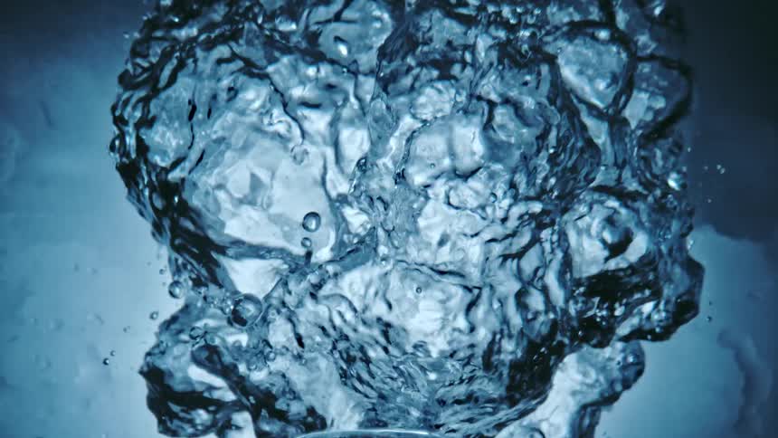 Water being shot into openness creating bubbles and droplets