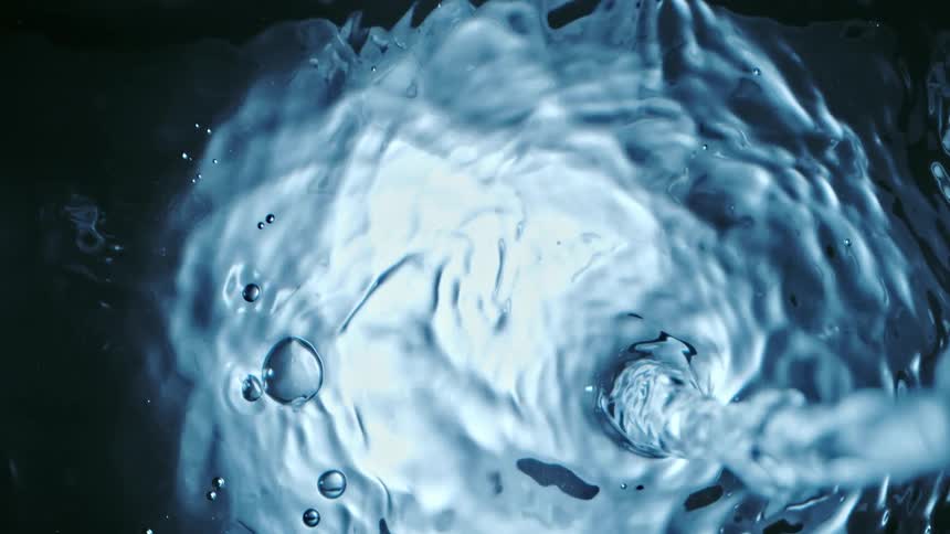 Slow motion view of water being poured is displayed