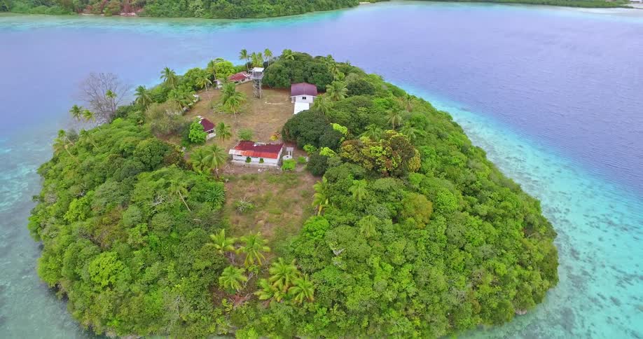 A small island has houses up on the hill