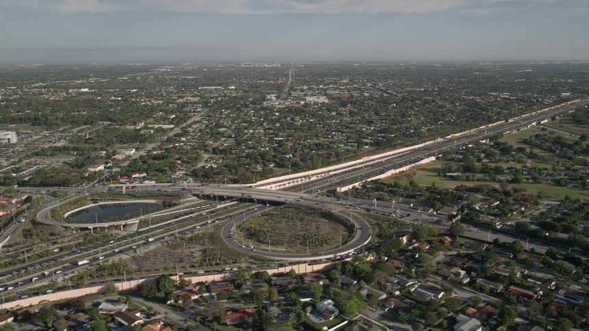 An aerial video clip of a busy interchange on Highway 874 and 990 in Kendall Florida during daytime